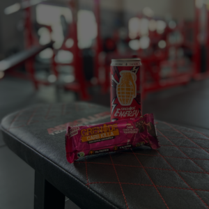 An energy drink and protein bar in the gym